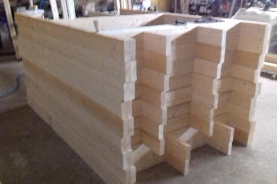 Fabrication mur ossature bois 1445/45 mm pour maison de plein pied.